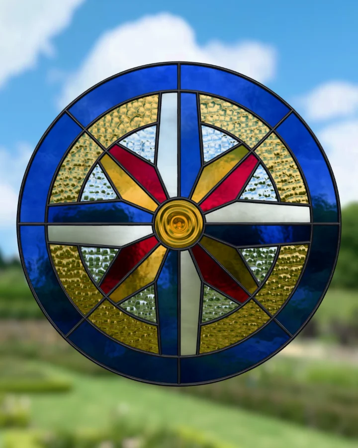 Compass rose suncatcher glazed, lit from behind.