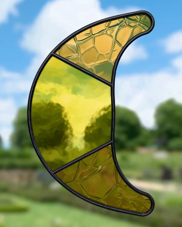 Crescent moon suncatcher glazed, lit from behind.