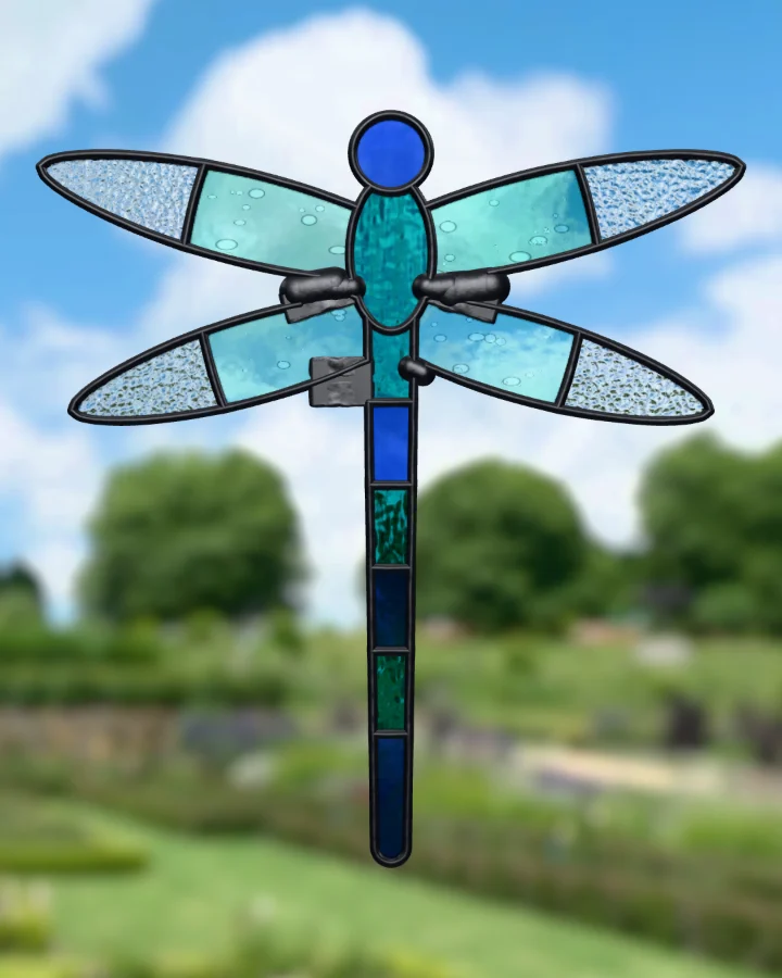 Dragonfly suncatcher glazed, lit from behind.