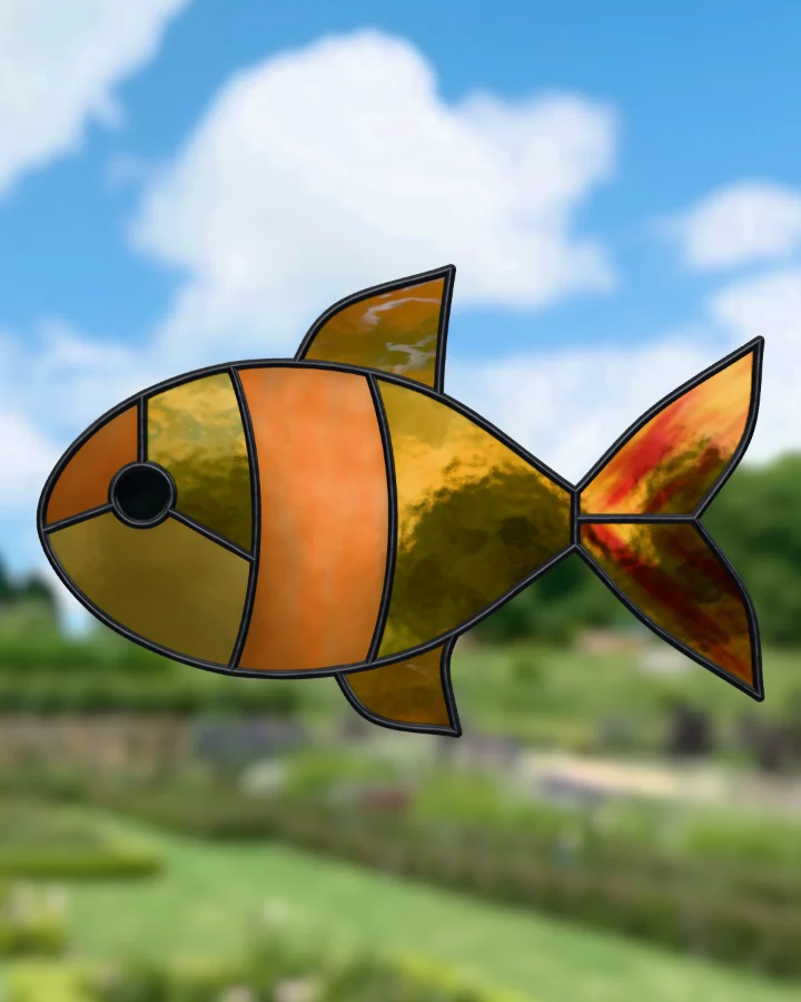 Fish suncatcher glazed, lit from behind.