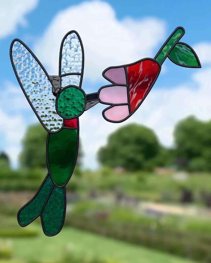 Hummingbird suncatcher glazed, lit from behind.