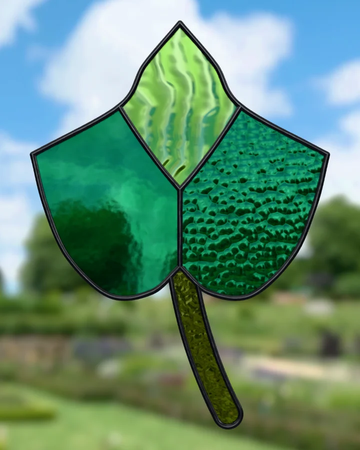 Ivy leaf suncatcher glazed, lit from behind.