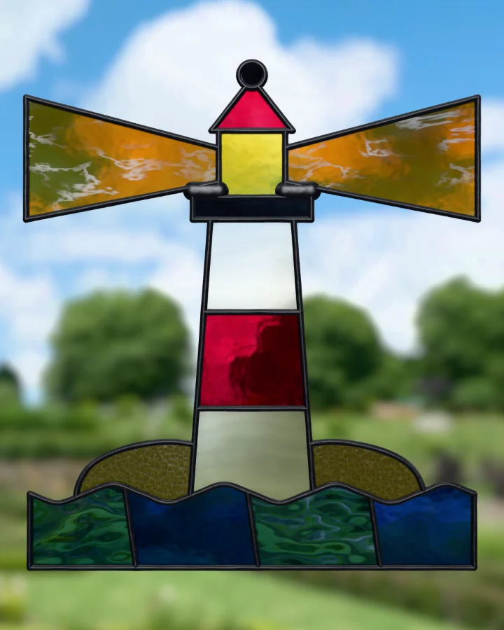 Lighthouse suncatcher glazed, lit from behind.