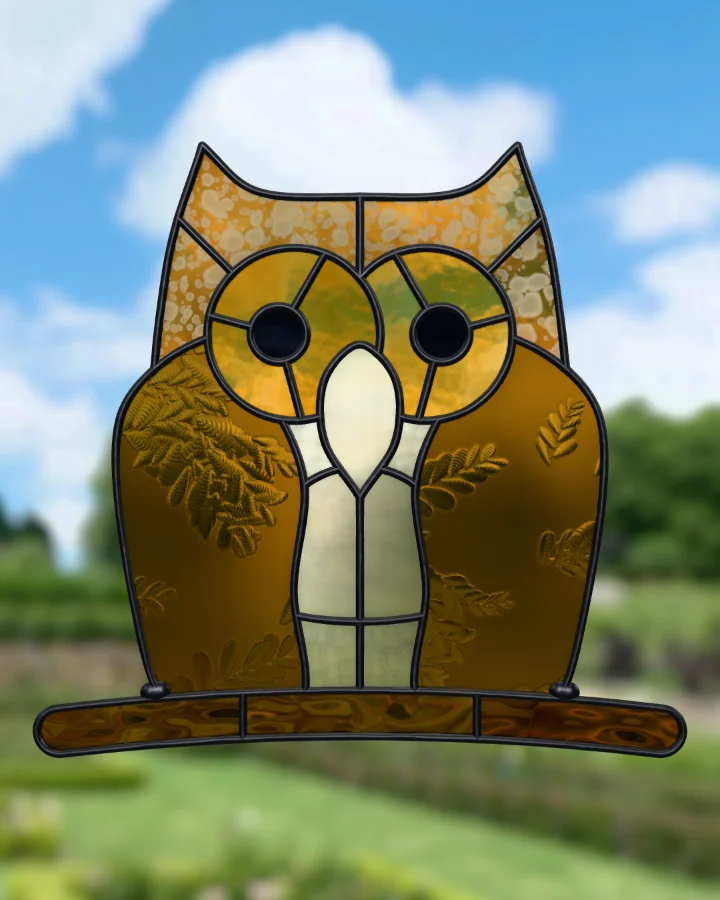 Owl suncatcher glazed, lit from behind.