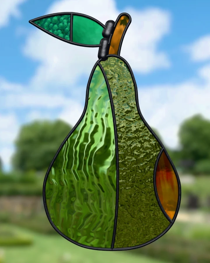 Pear suncatcher glazed, lit from behind.