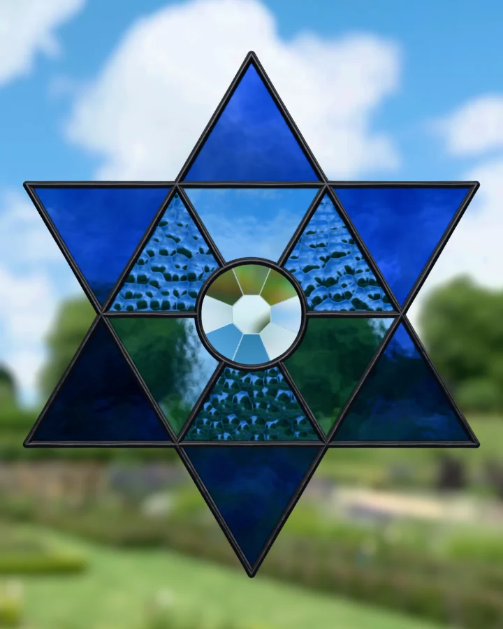 Six-point star suncatcher glazed, lit from behind.